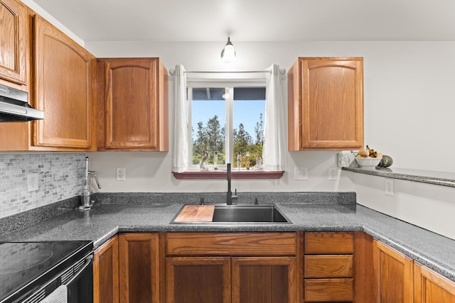 11-3458 Lehua St, Mountain View, HI 96771 - kitchen featuring a sink, dark countertops, and brown cabinetry