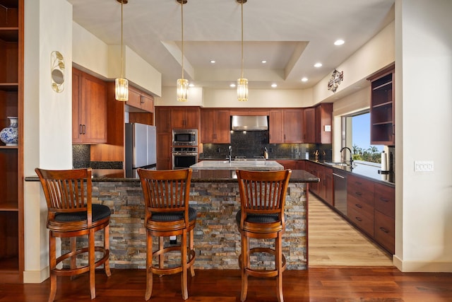 73-1138 Hamo St, Kailua-Kona, HI 96740 - kitchen with appliances with stainless steel finishes, a sink, a peninsula, decorative backsplash, and recessed lighting