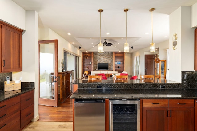 73-1138 Hamo St, Kailua-Kona, HI 96740 - kitchen featuring beverage cooler, open floor plan, light wood finished floors, built in shelves, and pendant lighting