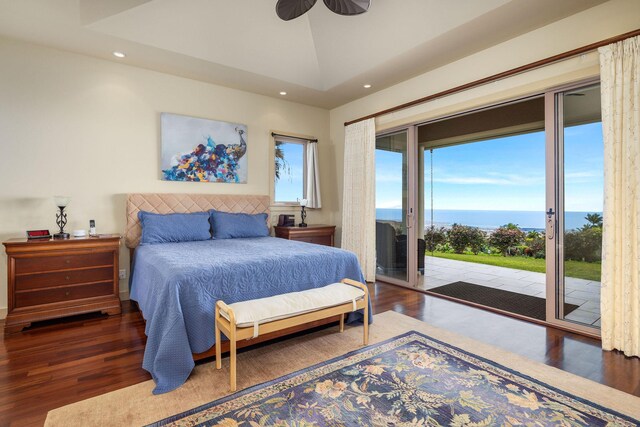 73-1138 Hamo St, Kailua-Kona, HI 96740 - bedroom featuring wood finished floors, access to exterior, recessed lighting, vaulted ceiling, and a water view