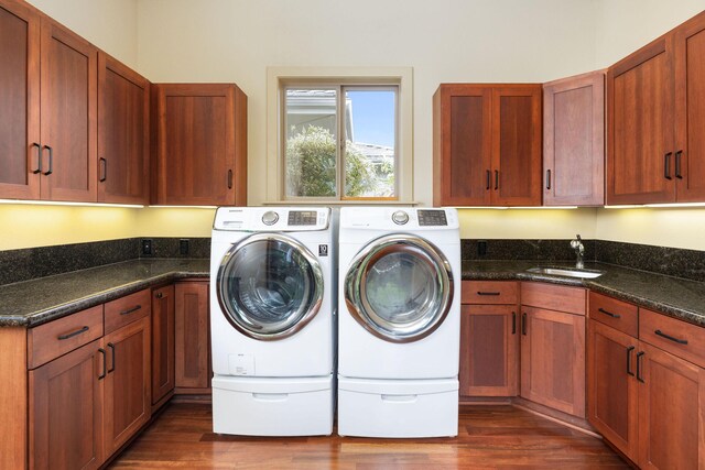 73-1138 Hamo St, Kailua-Kona, HI 96740 - washroom with washer and dryer, dark wood finished floors, and cabinet space