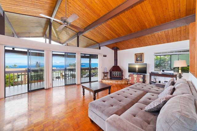 73-4327 Oneone St, Kailua-Kona, HI 96740 - living area featuring a wood stove, a wood ceiling with exposed beams, a ceiling fan, and high vaulted ceiling
