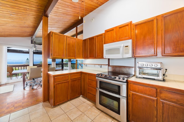 73-4327 Oneone St, Kailua-Kona, HI 96740 - kitchen featuring white microwave, double oven range, tile counters, wooden ceiling, and an office area