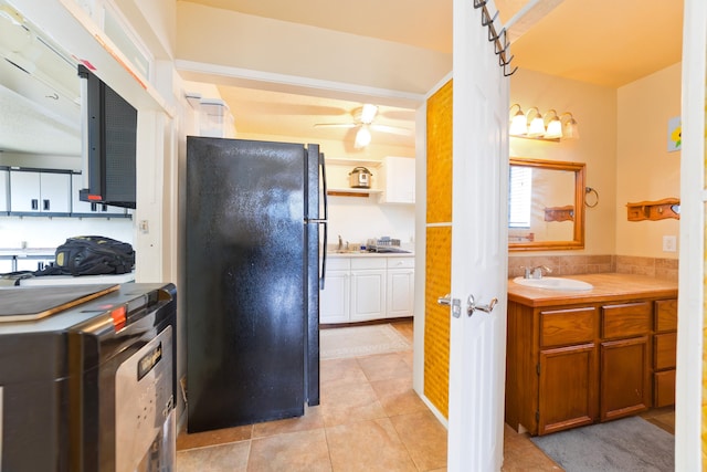 73-4327 Oneone St, Kailua-Kona, HI 96740 - kitchen featuring freestanding refrigerator, a ceiling fan, light tile patterned floors, light countertops, and brown cabinets