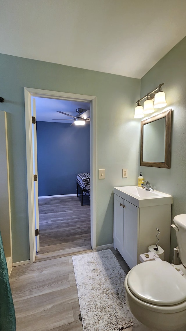 15-159 S Puni Lapa Loop, Pahoa, HI 96778 - bathroom with vanity, wood finished floors, toilet, baseboards, and a ceiling fan