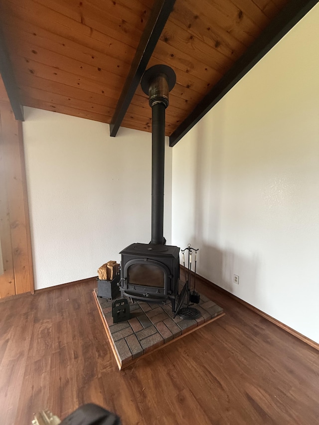 1572 Kaupili Pl, Hilo, HI 96720 - detailed view of a wood stove, wood ceiling with exposed beams, and wood finished floors