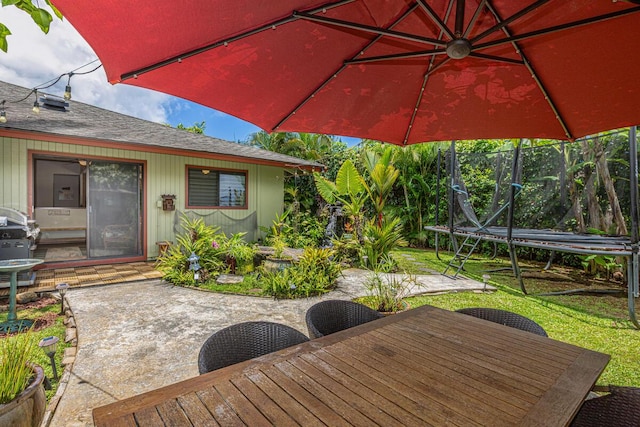 4030 Pauahi Pl, Princeville, HI 96722 - view of patio with a trampoline, outdoor dining space, and a grill