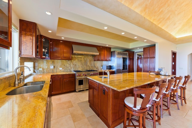 73-4558 Kukuki St, Kailua-Kona, HI 96740 - kitchen featuring wall chimney range hood, high quality appliances, a tray ceiling, backsplash, and recessed lighting