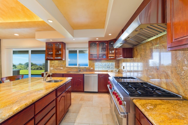 73-4558 Kukuki St, Kailua-Kona, HI 96740 - kitchen featuring appliances with stainless steel finishes, exhaust hood, light stone countertops, recessed lighting, and decorative backsplash