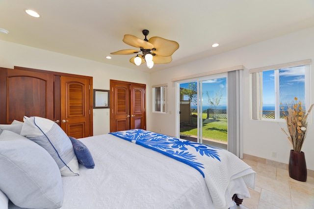 73-4558 Kukuki St, Kailua-Kona, HI 96740 - bedroom with access to exterior, two closets, recessed lighting, a ceiling fan, and light tile patterned floors