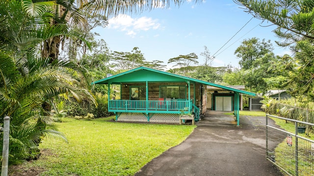 14-3531 Nanawale Blvd, Pahoa, HI 96778 - view of front of home featuring a porch, driveway, and an attached carport