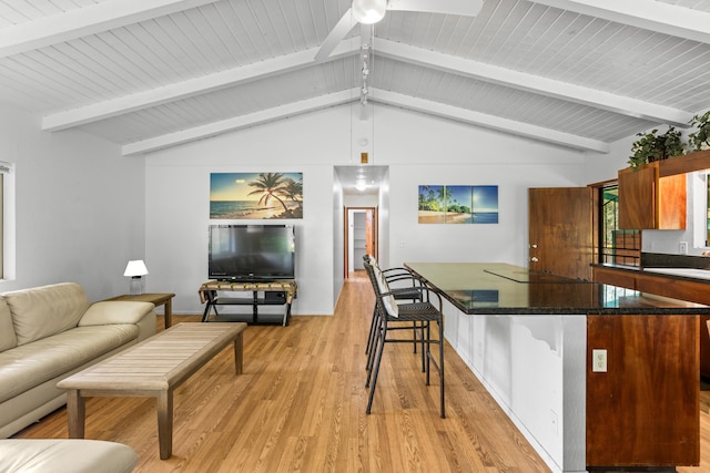 14-3531 Nanawale Blvd, Pahoa, HI 96778 - kitchen featuring dark countertops, light wood-type flooring, a kitchen breakfast bar, and open floor plan