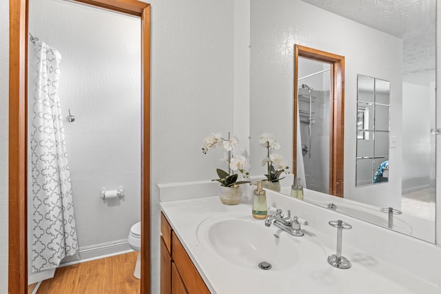 14-3531 Nanawale Blvd, Pahoa, HI 96778 - bathroom featuring vanity, wood finished floors, a shower with shower curtain, toilet, and baseboards