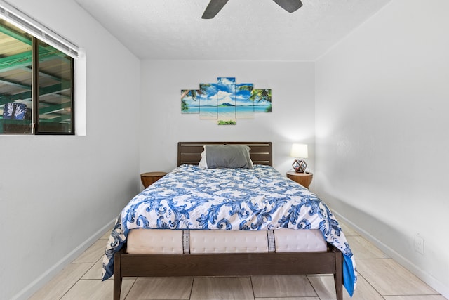 14-3531 Nanawale Blvd, Pahoa, HI 96778 - bedroom featuring a textured ceiling, baseboards, and ceiling fan