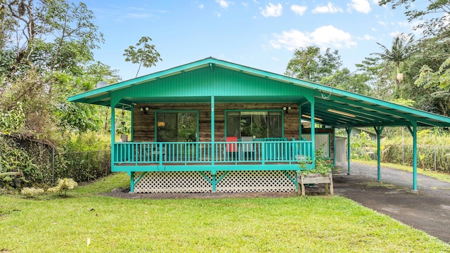 14-3531 Nanawale Blvd, Pahoa, HI 96778 - view of front of home with covered porch, a carport, and asphalt driveway