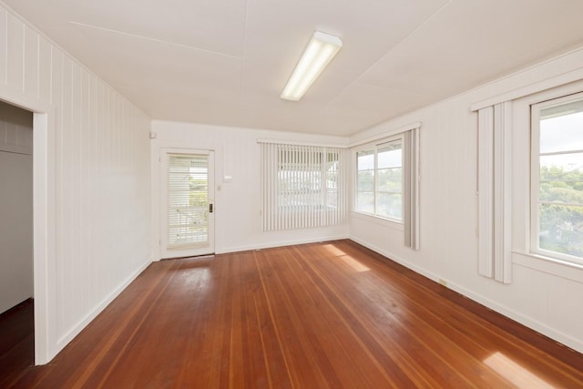 1969-A Kilauea Ave, Hilo, HI 96720 - unfurnished room with wood-type flooring and plenty of natural light