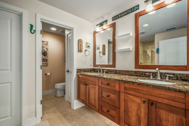 2611 Kiahuna Plantation Dr Unit 13D, Koloa, HI 96756 - full bath featuring double vanity, tile patterned flooring, toilet, and baseboards