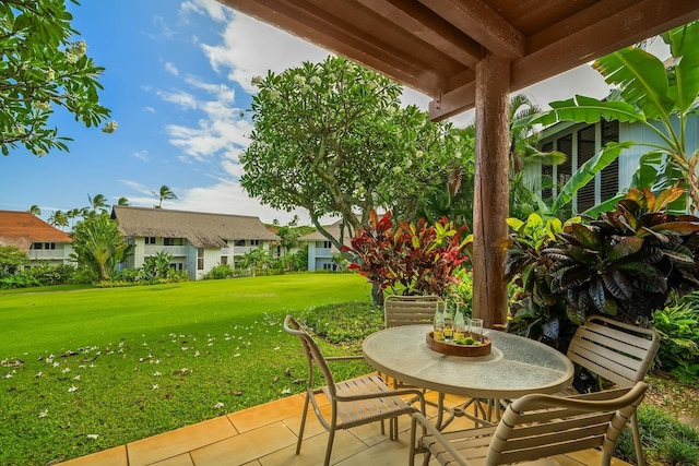 2253 Poipu Rd Unit 115, Koloa, HI 96756 - view of patio featuring outdoor dining space and a residential view