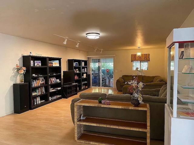 81-2026 Haku Nui Rd, Captain Cook, HI 96704 - living area featuring wood finished floors and track lighting