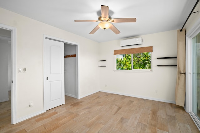 5372 Kumole St, Kapaa, HI 96746 - unfurnished bedroom with a wall mounted AC, light wood-style flooring, baseboards, a closet, and a ceiling fan