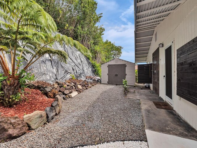 28-2855 Onomea Pl, Pepeekeo, HI 96783 - view of patio / terrace featuring a storage unit
