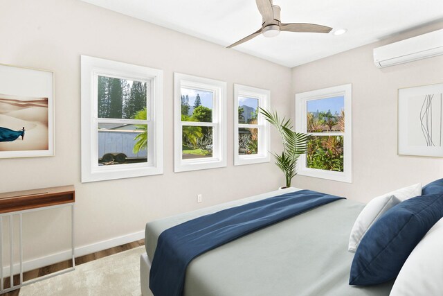 4576 Emmalani Dr, Princeville, HI 96722 - bedroom featuring a wall mounted AC, wood finished floors, recessed lighting, baseboards, and ceiling fan