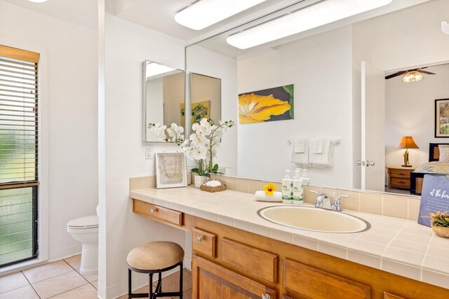1565 Pee Rd Unit 221, Koloa, HI 96756 - bathroom featuring toilet, tile patterned flooring, vanity, and ceiling fan
