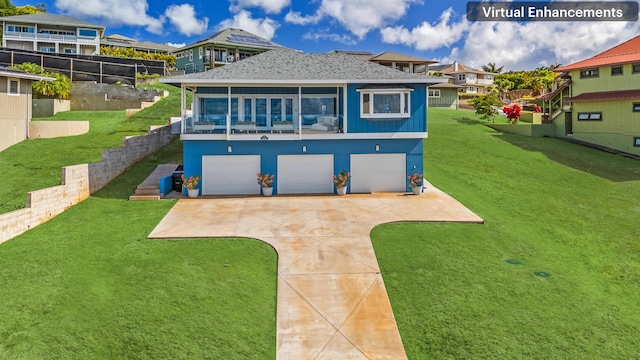 1172 Lani Nu U St, Kalaheo, HI 96741 - back of property featuring concrete driveway, a garage, a yard, and a shingled roof