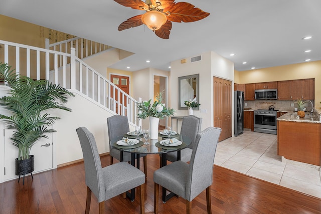 75-6060 Kuakini Hwy Unit B1, Kailua-Kona, HI 96740 - dining space featuring light wood-style flooring, a ceiling fan, stairway, and recessed lighting