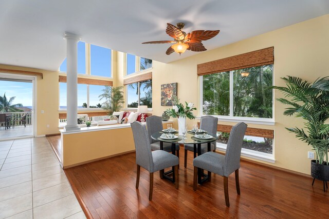 75-6060 Kuakini Hwy Unit B1, Kailua-Kona, HI 96740 - dining space with ornate columns, plenty of natural light, ceiling fan, and light wood-style floors