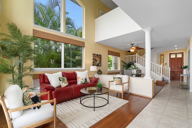 75-6060 Kuakini Hwy Unit B1, Kailua-Kona, HI 96740 - living room with ornate columns, a ceiling fan, a towering ceiling, and wood finished floors