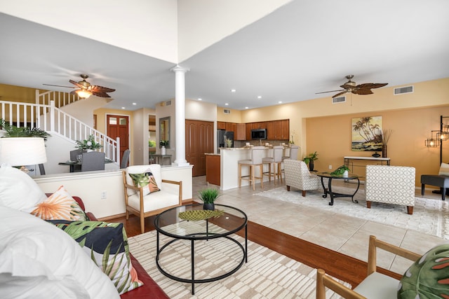 75-6060 Kuakini Hwy Unit B1, Kailua-Kona, HI 96740 - living area featuring ceiling fan, decorative columns, stairs, light wood-type flooring, and recessed lighting