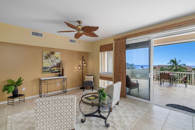 75-6060 Kuakini Hwy Unit B1, Kailua-Kona, HI 96740 - living room with light tile patterned floors and ceiling fan