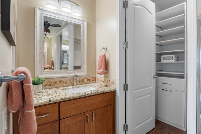 75-6060 Kuakini Hwy Unit B1, Kailua-Kona, HI 96740 - bathroom with vanity, a ceiling fan, and wood finished floors