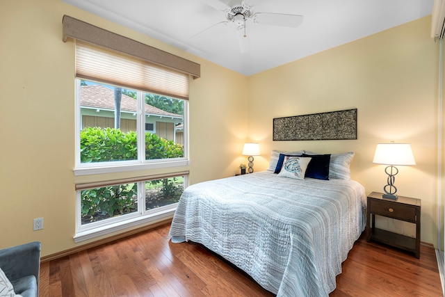 75-6060 Kuakini Hwy Unit B1, Kailua-Kona, HI 96740 - bedroom with wood finished floors and a ceiling fan