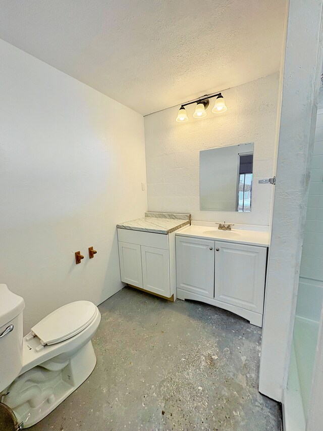 16-2122 Ginger Ln, Pahoa, HI 96778 - full bathroom featuring toilet, vanity, a textured ceiling, and concrete floors