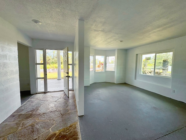 16-2122 Ginger Ln, Pahoa, HI 96778 - empty room with a textured ceiling and concrete floors