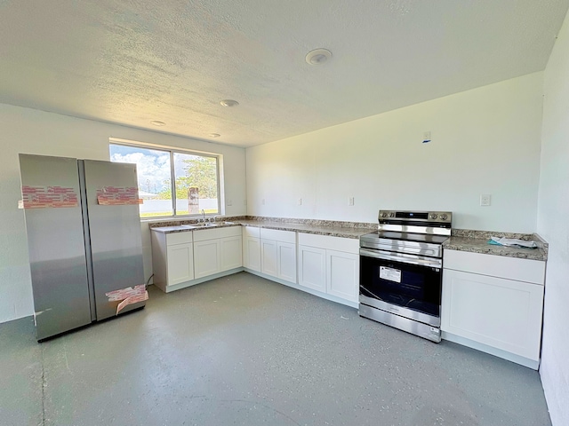 16-2122 Ginger Ln, Pahoa, HI 96778 - kitchen featuring stainless steel appliances, white cabinets, a sink, a textured ceiling, and light countertops