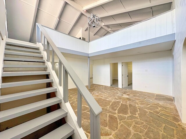 16-2122 Ginger Ln, Pahoa, HI 96778 - staircase featuring stone floors, high vaulted ceiling, and beam ceiling