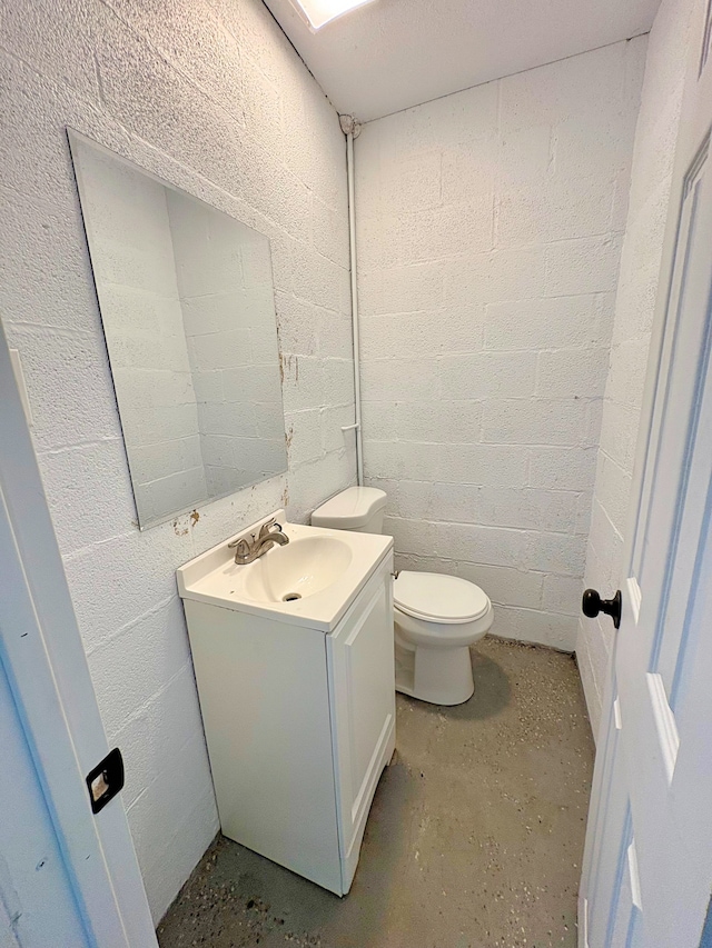 16-2122 Ginger Ln, Pahoa, HI 96778 - half bathroom with vanity, toilet, concrete block wall, and concrete flooring