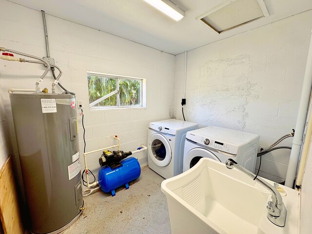 16-2122 Ginger Ln, Pahoa, HI 96778 - laundry room featuring electric water heater, separate washer and dryer, attic access, and concrete block wall