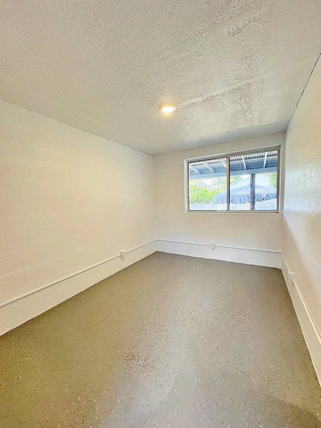 16-2122 Ginger Ln, Pahoa, HI 96778 - empty room featuring a textured ceiling and baseboards