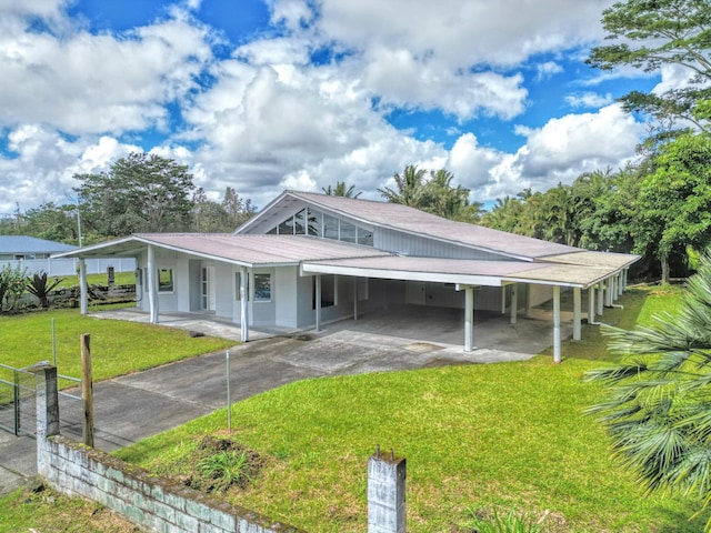 16-2122 Ginger Ln, Pahoa, HI 96778 - view of front facade with a carport, asphalt driveway, a front yard, and metal roof