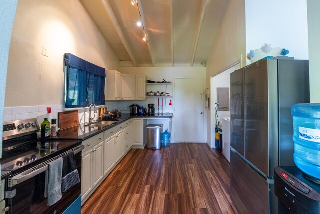 16-2103 Kuleana St, Pahoa, HI 96778 - kitchen featuring stainless steel appliances, dark wood-type flooring, dark countertops, white cabinetry, and electric panel