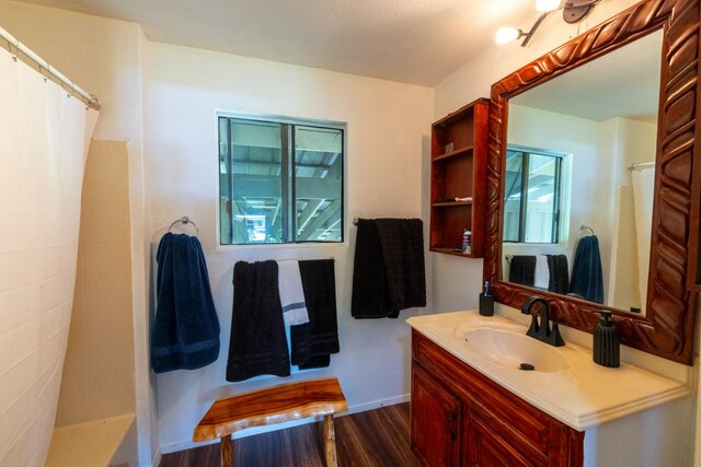 16-2103 Kuleana St, Pahoa, HI 96778 - bathroom with vanity, wood finished floors, and a shower with curtain