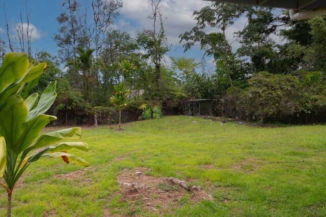 16-2103 Kuleana St, Pahoa, HI 96778 - view of grassy yard featuring view of wooded area