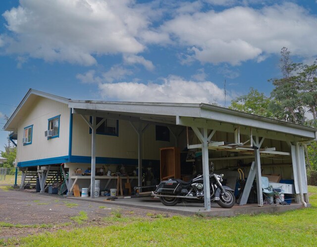 16-2103 Kuleana St, Pahoa, HI 96778 - rear view of house featuring a carport