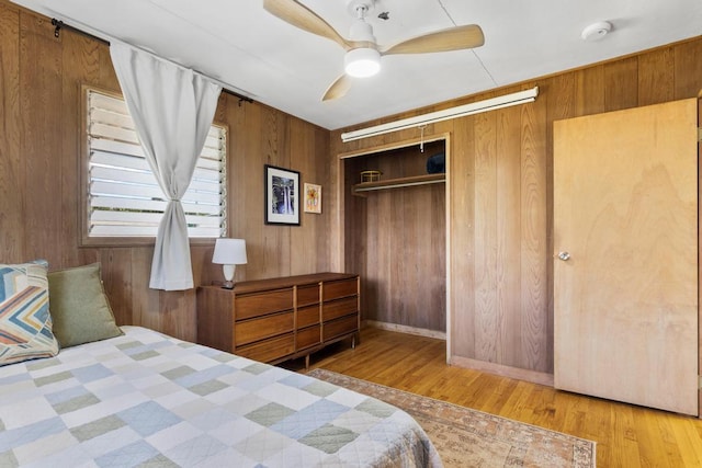 35 Pono St, Hilo, HI 96720 - bedroom featuring wooden walls, wood finished floors, a closet, and ceiling fan