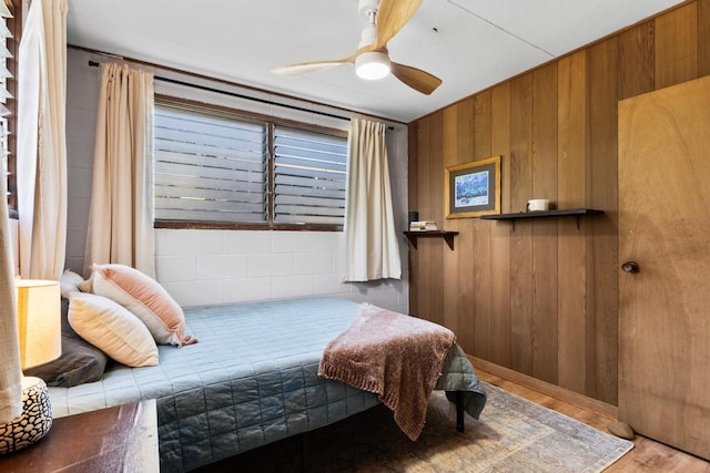 35 Pono St, Hilo, HI 96720 - bedroom featuring wood finished floors, wood walls, and ceiling fan