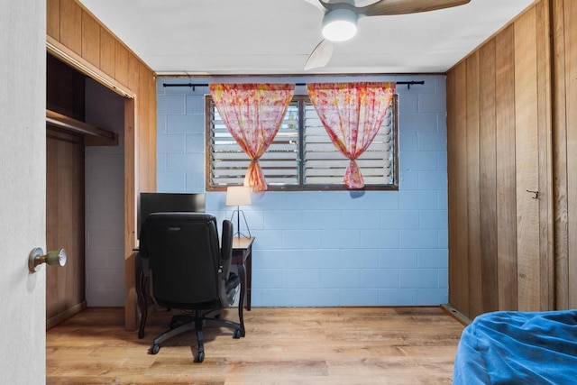 35 Pono St, Hilo, HI 96720 - bedroom featuring wood finished floors, a desk, concrete block wall, and a ceiling fan